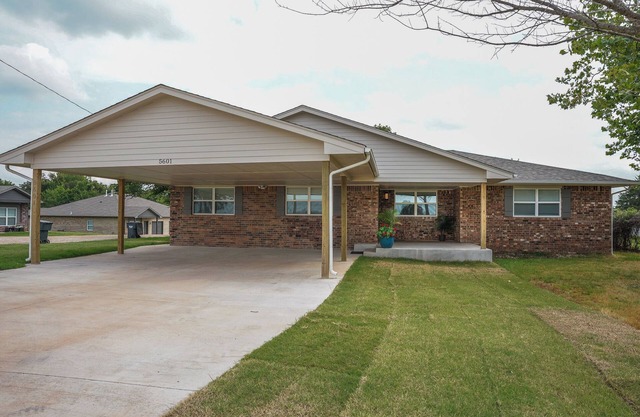 Spacious 5-bedroom house with covered parking and private backyard in Guthrie.