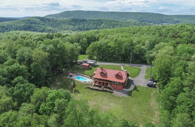 Spacious 6BR Log Cabin Retreat with Pool, Hot Tub & Stunning Mountain Views