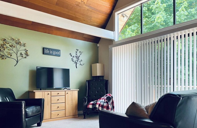 Spacious A-frame backed by thick forest