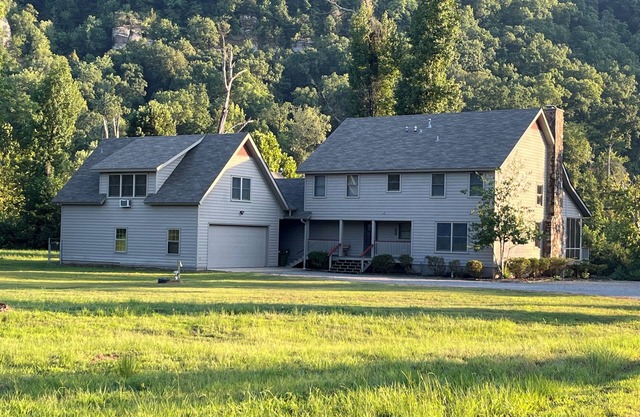 Spacious family home on the banks of the Little Red River in Heber Springs AR.