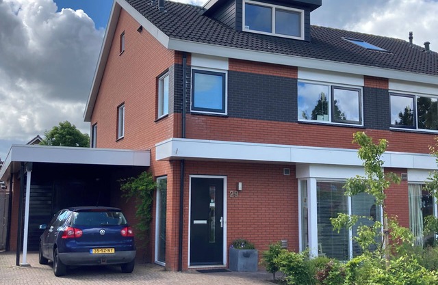 Spacious family house for up to 8 people with garden and playground in front.