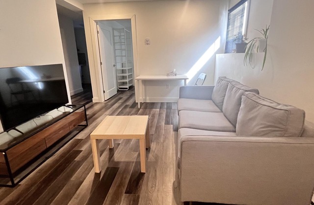 Spacious one bedroom basement apartment with 2 queen size beds &private entrance