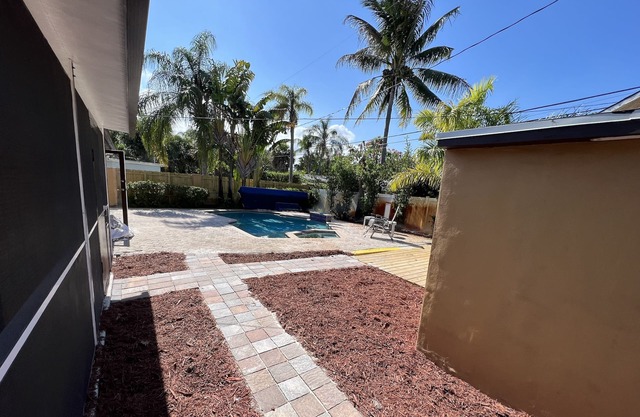 Spacious pool home with detached efficiency. Close to airport, beaches, downtown