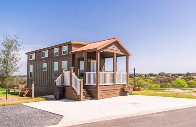 Spacious Ridge-Top Tiny Home 'Copper Ridge' Features Seven-Person Capacity, 1.5 Baths, and Front Por