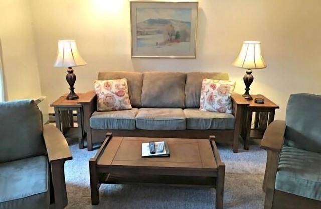 Spacious Two-Level Family Condominium Unit Featuring Full Kitchen, Private Balcony, Jetted Tub, and
