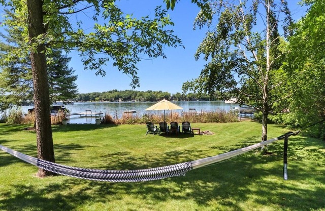 Spacious, Upscale Whitewater Lake Home |200+ Ft of Lake Frontage |Swim Deck |Docks |Screened Porch