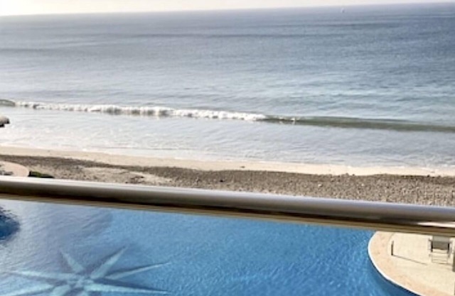 Spectacular Beach Front Condo. Small bldg with infinity pool and gym .