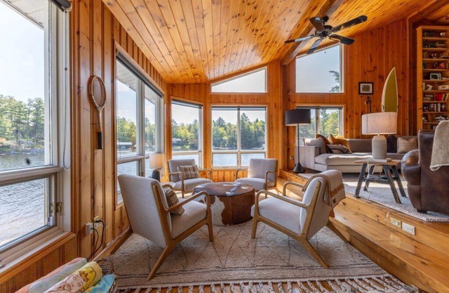Spectacular View of Lake Muskoka with Guest Cottage above Boathouse