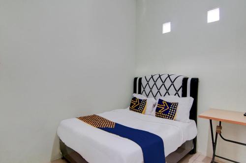 SPOT ON 92797 Awi Stay Syariah Near SIMPANG KAWASAN INDUSTRI WILMAR PELINTUNG
