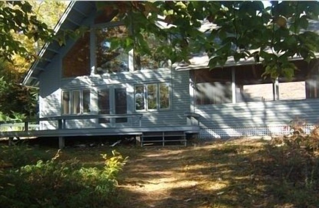 Lago Squam: casa frente al mar con gran porche con mosquitero