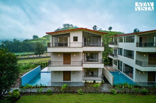 StayVista at Mount Brook with Mountain views, AC, Lawn
