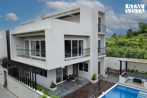StayVista at Oriana Palms with Wifi and Pool