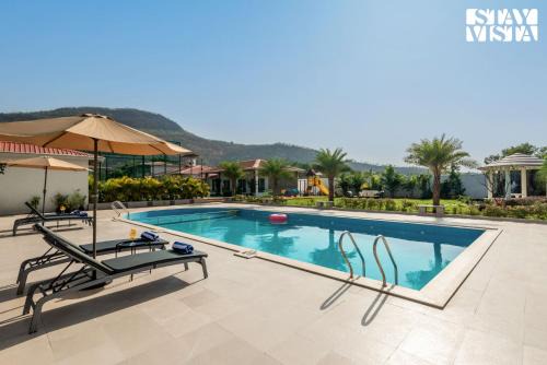 StayVista at The Grand Ten with lawn and pool