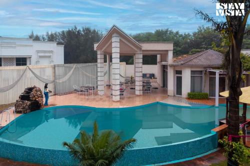 StayVista's Casba Farm Retreat - Pet-Friendly Villa with Rooftop Lounge, Outdoor Pool, Lawn & Bar