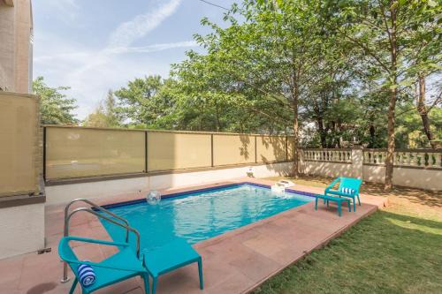 StayVista's Greenwoods Villa 5 - City-Center Villa with Private Pool, Terrace, Lift & Music System