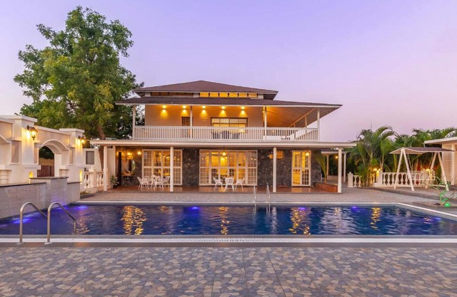StayVista's Lake La Vie - Tranquil Lake-View Villa Amidst Farmland with Pool and Poolside Gazebo - Proximity to Sula