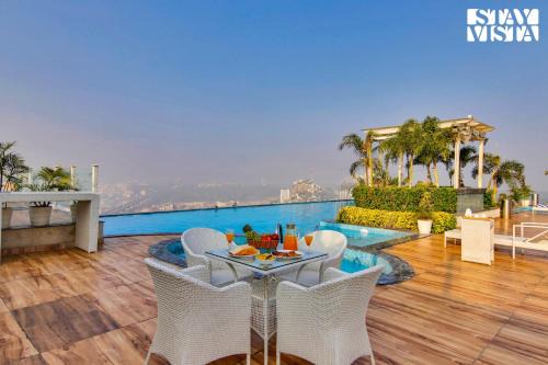 StayVista's Skyline Studio Apartments - Urban Oasis with Terrace, Gym & Bar