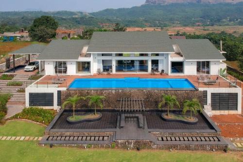 StayVista's Villa 107 at Canary Farms - Pure Veg with Huge Lawn, Pool and Home Theatre