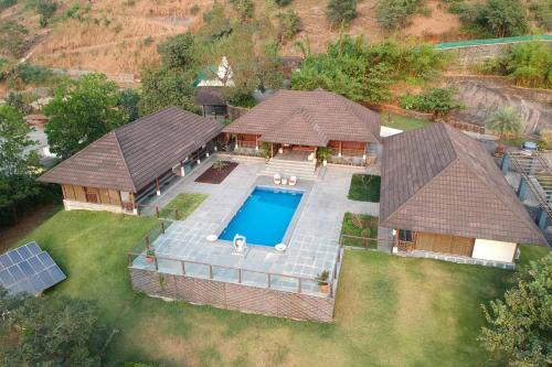 StayVista's Vyoman Villa - Experience a valley view, lush lawn, spa, and yoga retreat