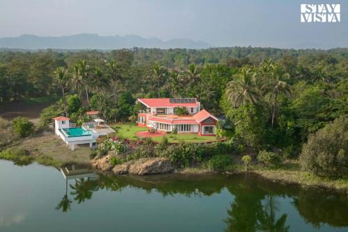 StayVista's Waterway Retreat - Lakeside Oasis with Infinity Pool