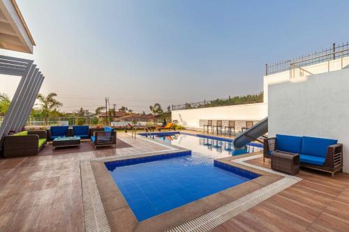 StayVista's White Pebbles - A Villa with Theater Room & Swimming Pool