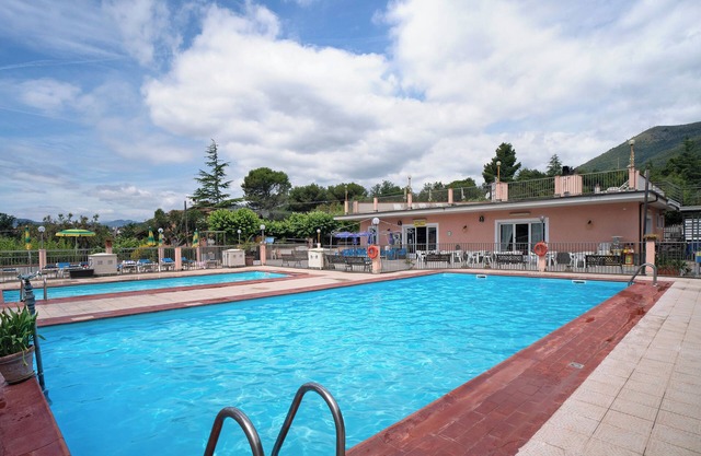 Apartamento estudio "Monolocale Con Soppalco 43" con piscina compartida, terraza privada y Wi-Fi