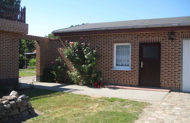 Apartamento vacacional con barbacoa en el jardín