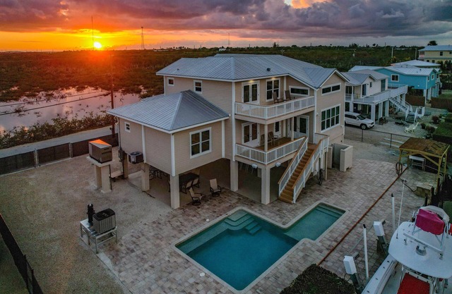 Stunning 4 bedroom 5.5 bath pool home with open water views