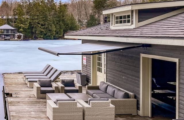 Stunning Cottage on Lake Joe! 6 bdrm,6 bath,2 slip boathouse! Water Toys Galore!