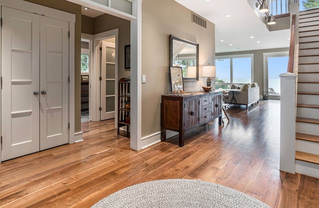 Stunning lakefront home & guest house with pool, beach, terraces, & views