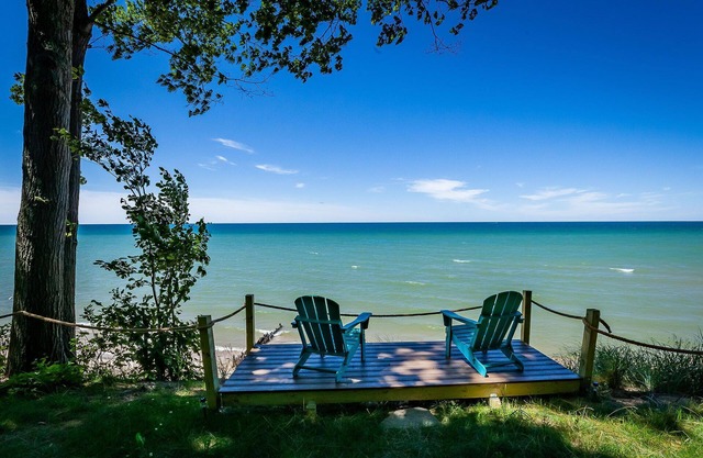 Stunning renovated cottage with 150' of private sandy Lake Michigan beachfront!