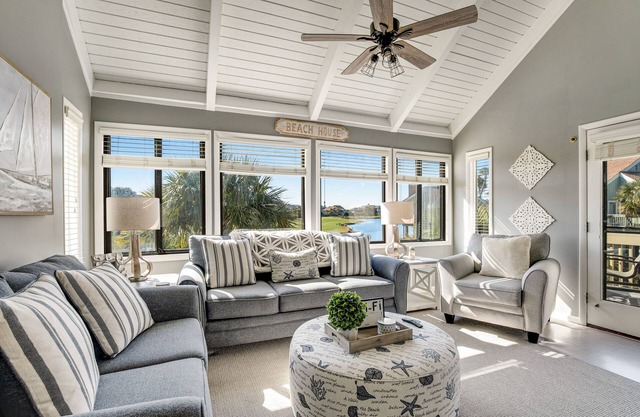Stylish beach villa with three decks, and golf course views