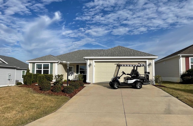 Stylish Home with Golf Cart, Lanai & Prime Location Near Town Squares!