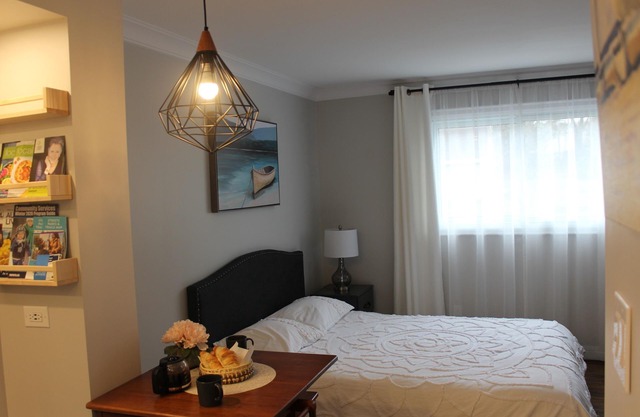 Stylish Main Level Suite with Separate Entrance, Private Patio and 2 Car Parking