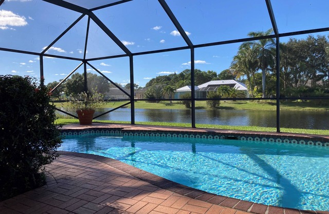 Stylish Waterfront Home w/Heated Pool, 8 miles to the Beach, Close to Shopping.