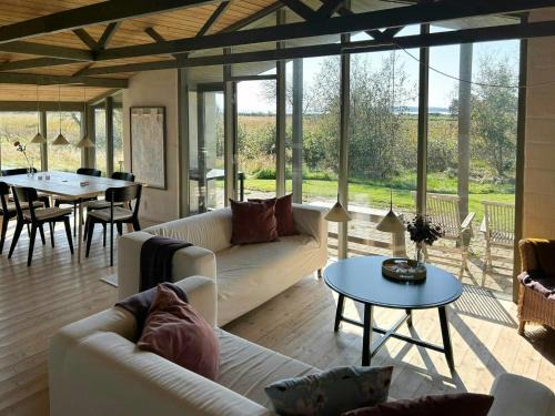 Summer House With Fields And Fjord Views