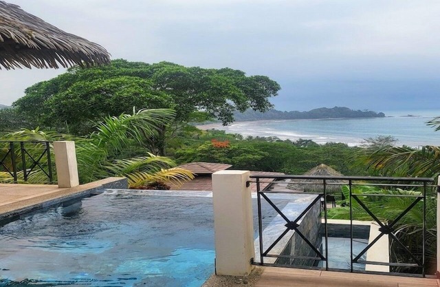 Sweeping ocean views, private infinity edge pool, & short walk to beach