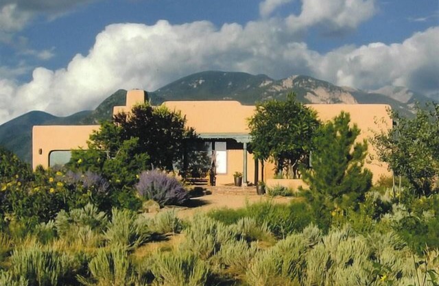 Sweeping panoramic mountain views, expansive adobe privacy wall system