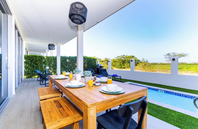 Sweet scape to a beautiful Villa just across Eagle Beach