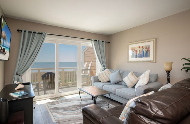 Swept Away: Modern Oceanfront Condo Steps from Community Pool