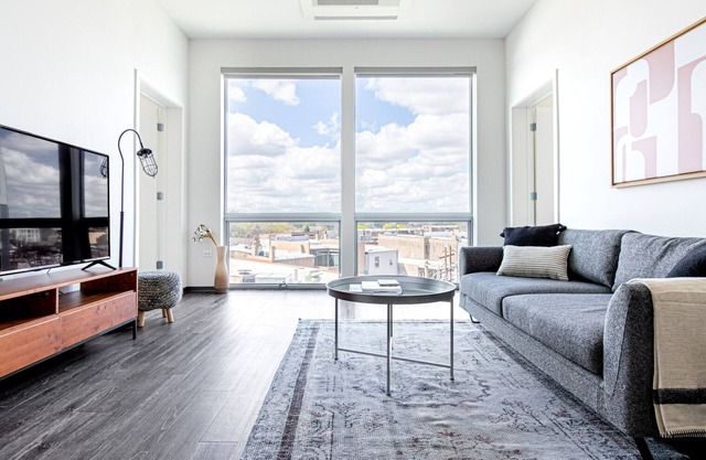 Tasteful Logan Square 2BR w/ Gym, Roof Deck, 1 block to L, by Blueground