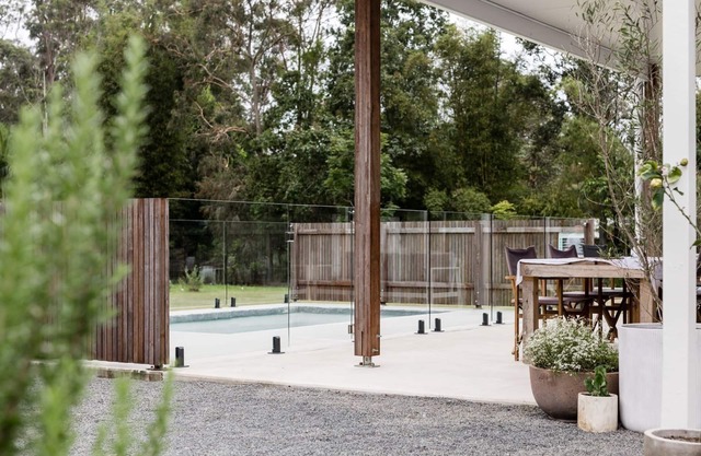 The Lake House - Escape the hustle and bustle and relax around the pool.