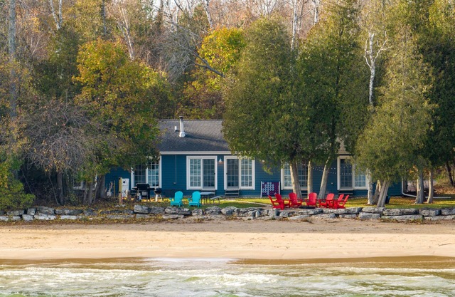 The lake is calling! With 140′ of sandy beach directly on Lake Michigan