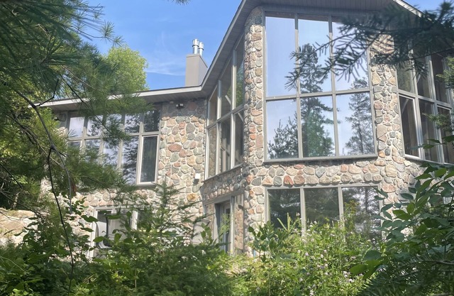 The newly remodeled Stone Cabin with sandy beach and clean clear water