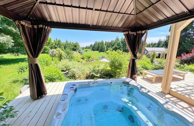 This cozy cottage offers a private hot tub, breathtaking forest views, and ultimate tranquillity