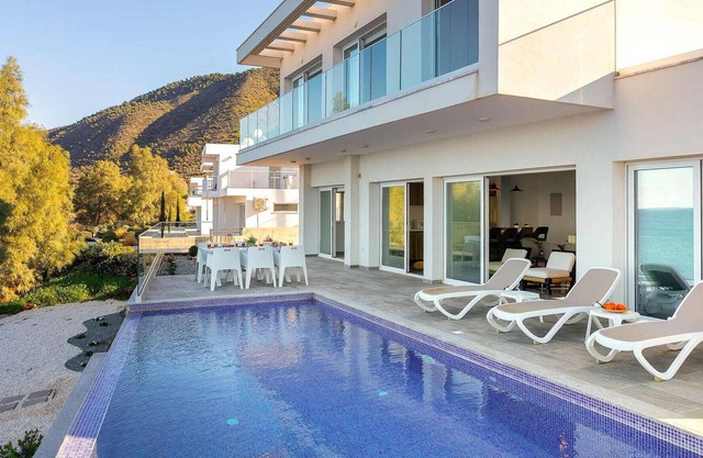 This stunning villa is modern and contemporary and has a wonderful location on the seafront in the v