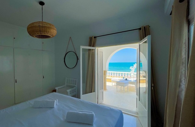 The Sea House beach front villa with pool