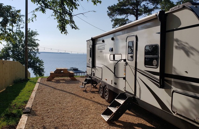 Toledo Bend Lakefront RV Slot with 34ft Camper and Beautiful Sunset Views