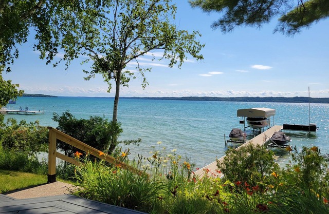 TorchLakeFlightDeck.com cottage with 180’ on Lakefront Waterfront Beachfront!