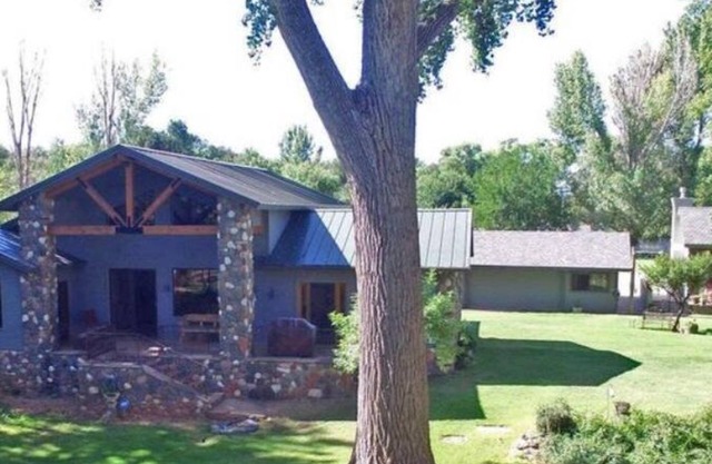 Tranquil home with lush outdoor space on the Oak Creek.